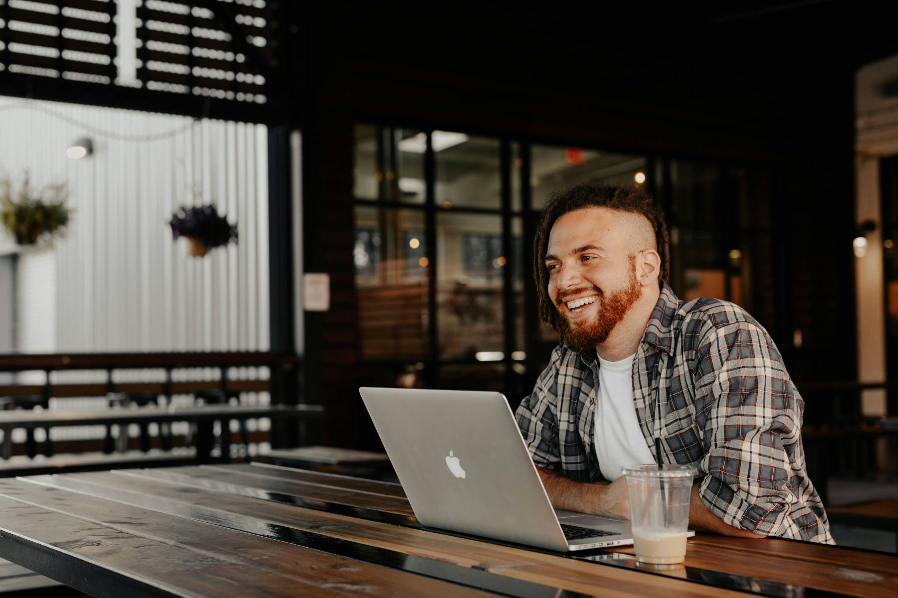 Man at a cafe on his laptop